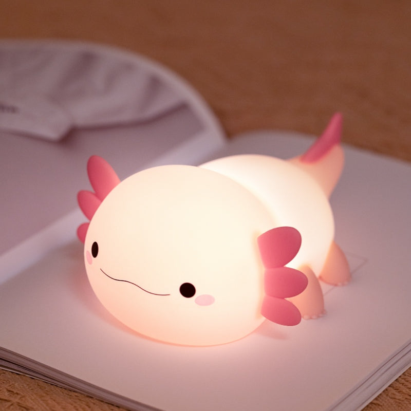 A daytime photo of the pink silicone axolotl night light when it is turned off